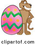 Big Cat Cartoon Vector Clipart of a Grinning Cougar Mascot Character with an Easter Egg by Mascot Junction