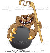 Big Cat Cartoon Vector Clipart of an Aggressive Cougar Mascot Character Grasping a Hockey Puck by Mascot Junction
